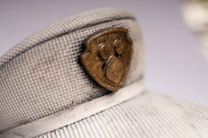 Detail of the concrete cap with the embossed badge emblem