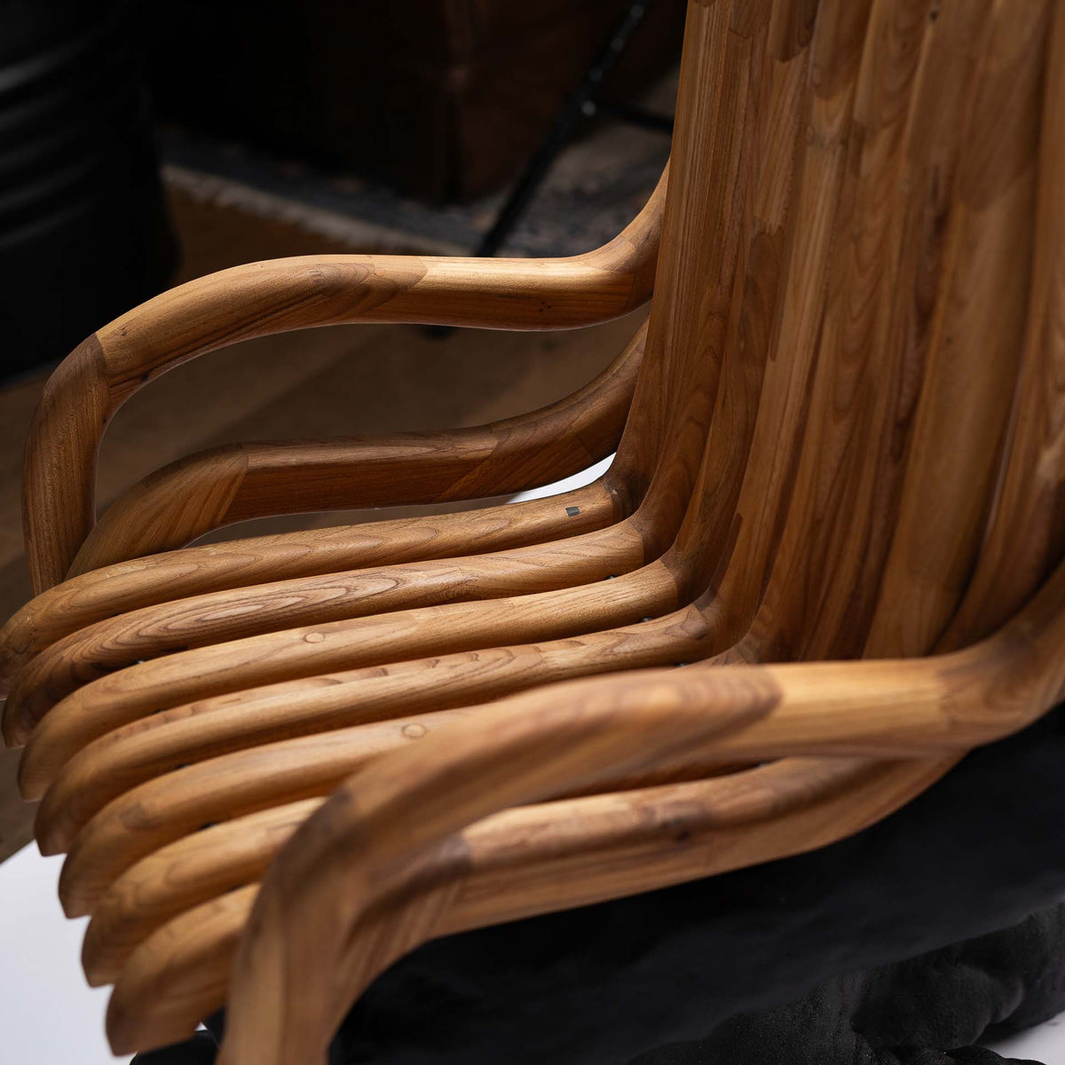 Detail of the curved wild-oak slats of the seat and armrest