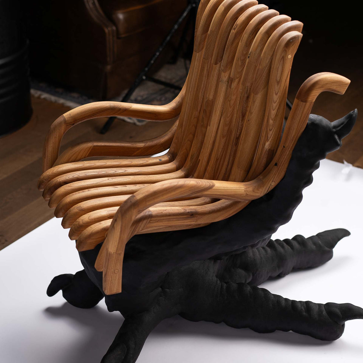 Chicken Feet Chair in a studio setting with a wooden floor